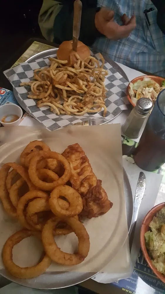 Fish and Onion Rings Along with Burger and Fries